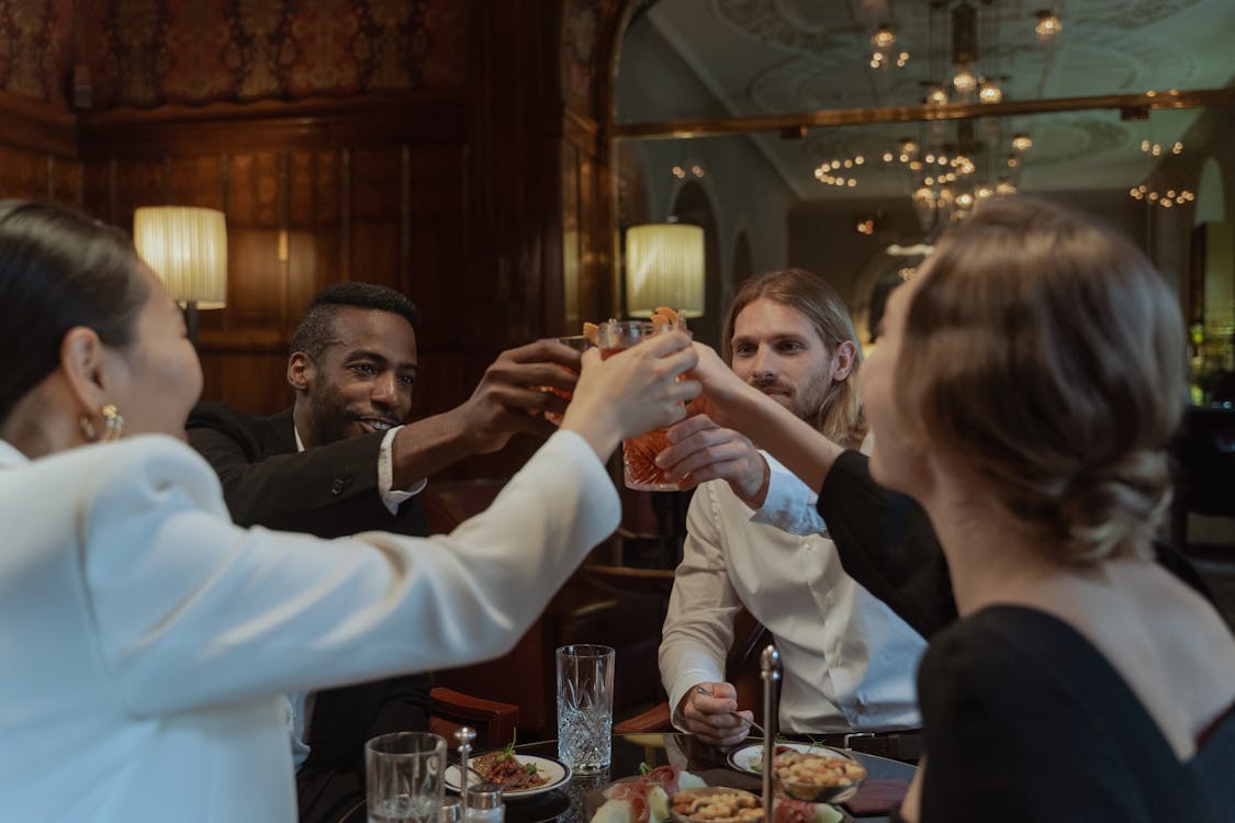 Team celebrating and toasting at a company dinner