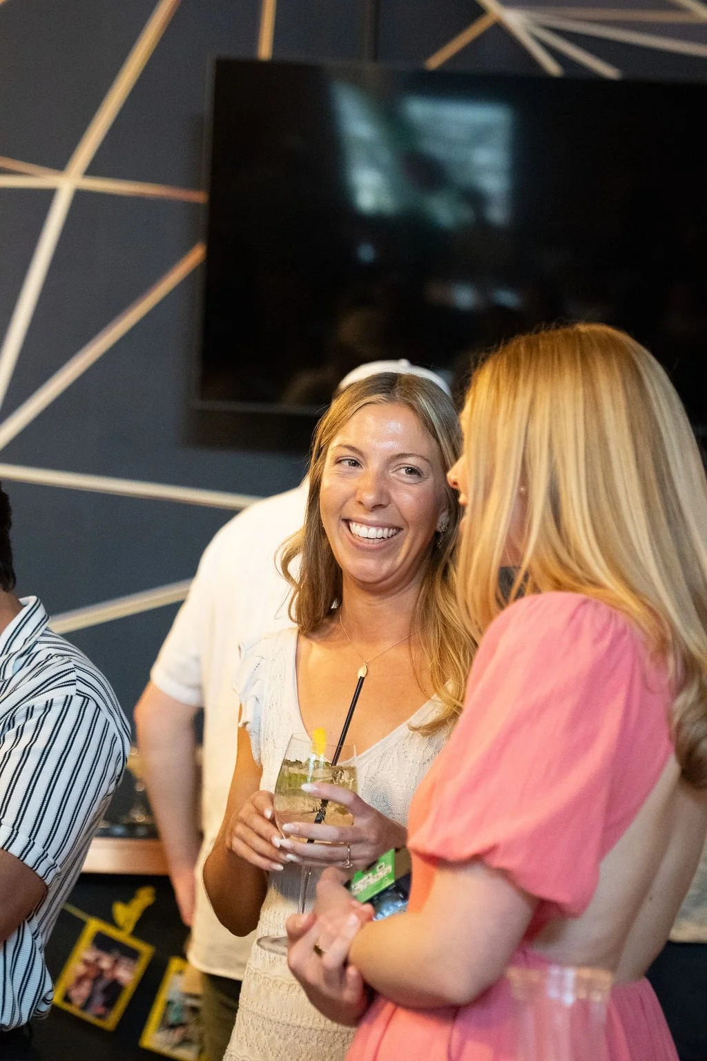 Guests laughing together during the engagement celebration