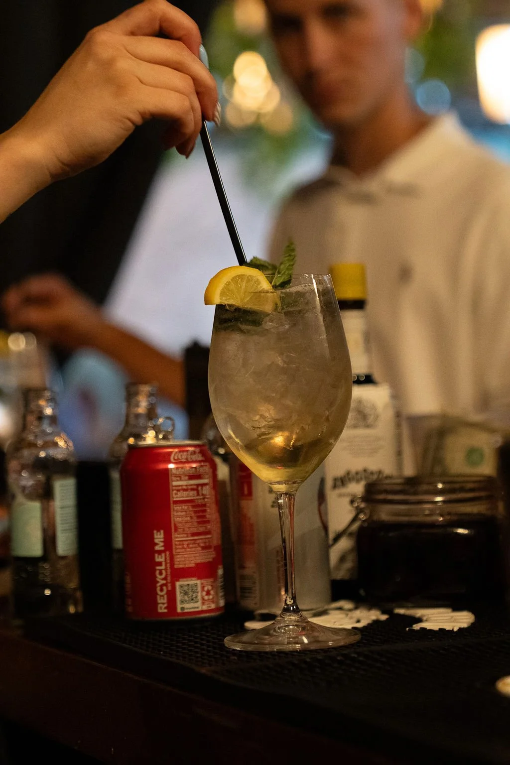 Signature cocktail being finished at the bar