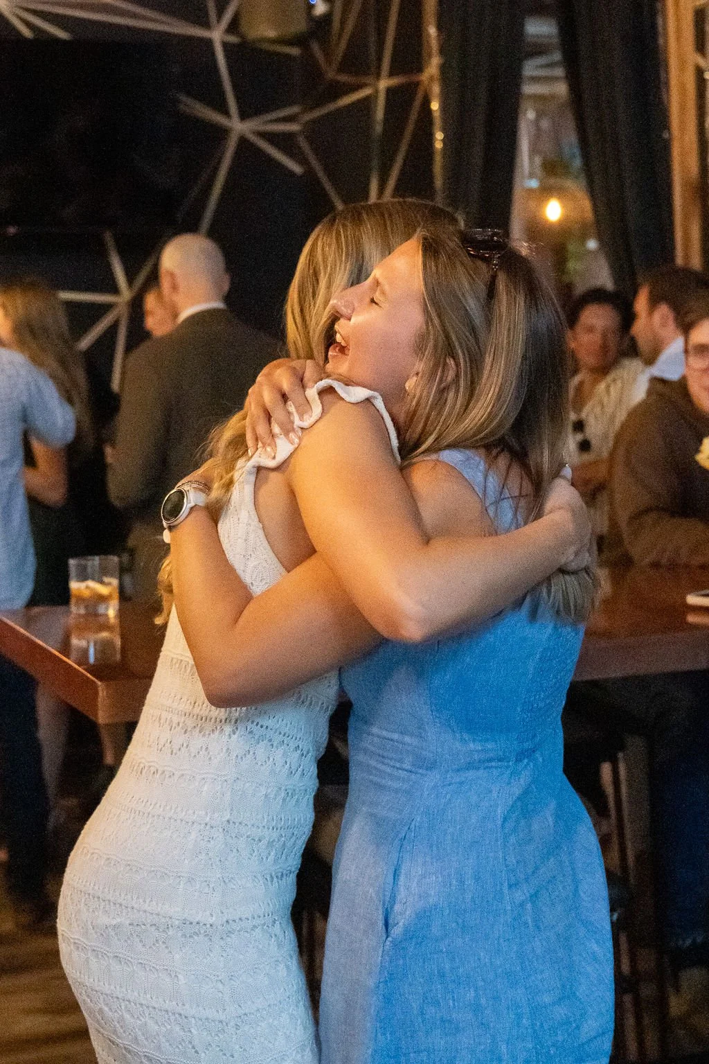 Guests embracing during the toast