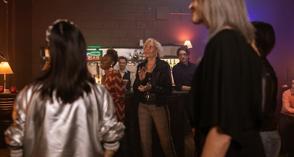 Group gathering at a bar for a watch party