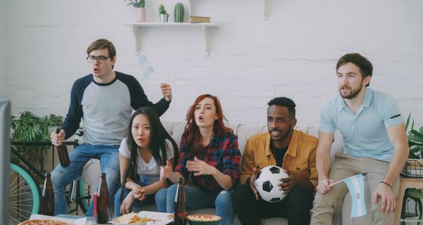 Friends watching soccer together