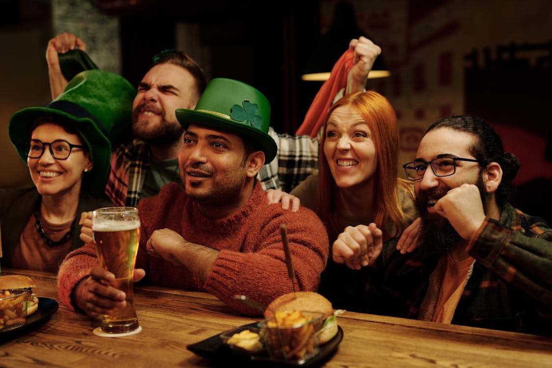 Group of fans watching soccer at an indoor sports bar
