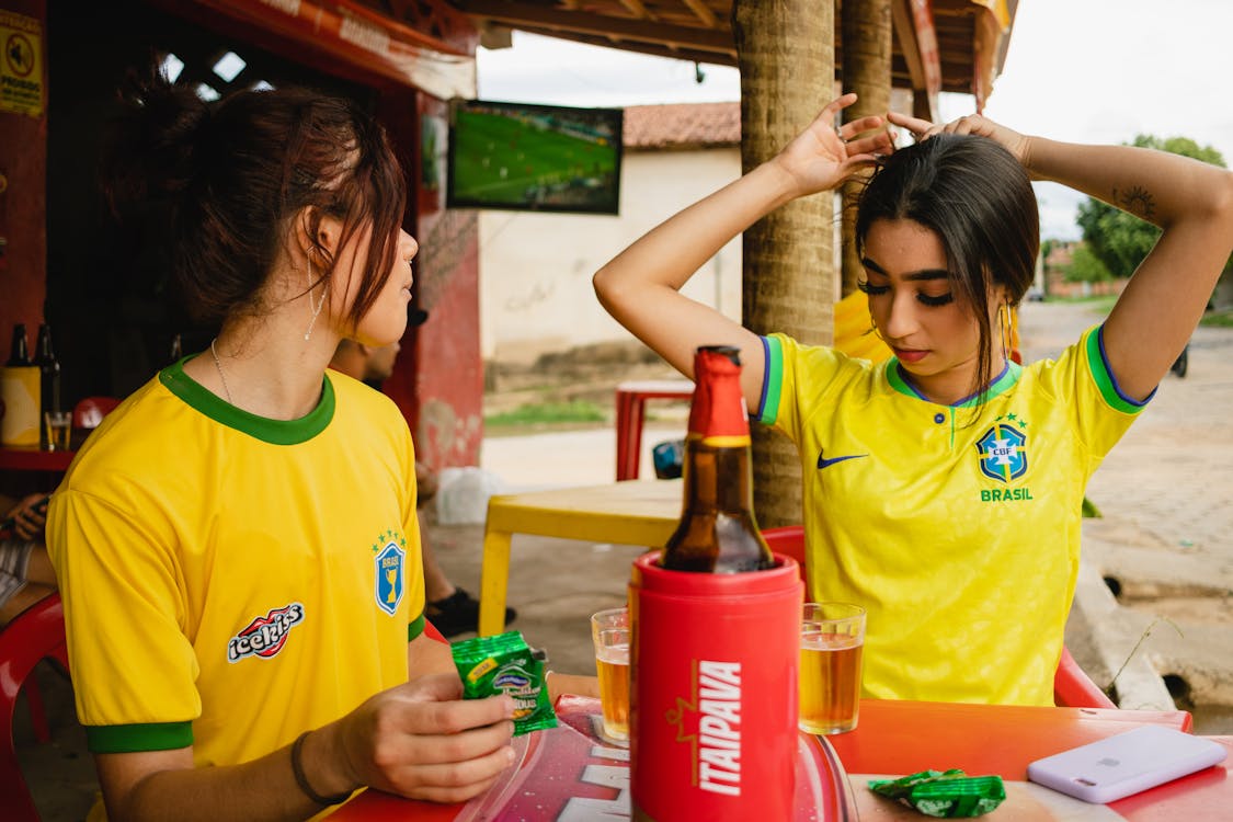 Soccer fan in jersey at an indoor bar during match